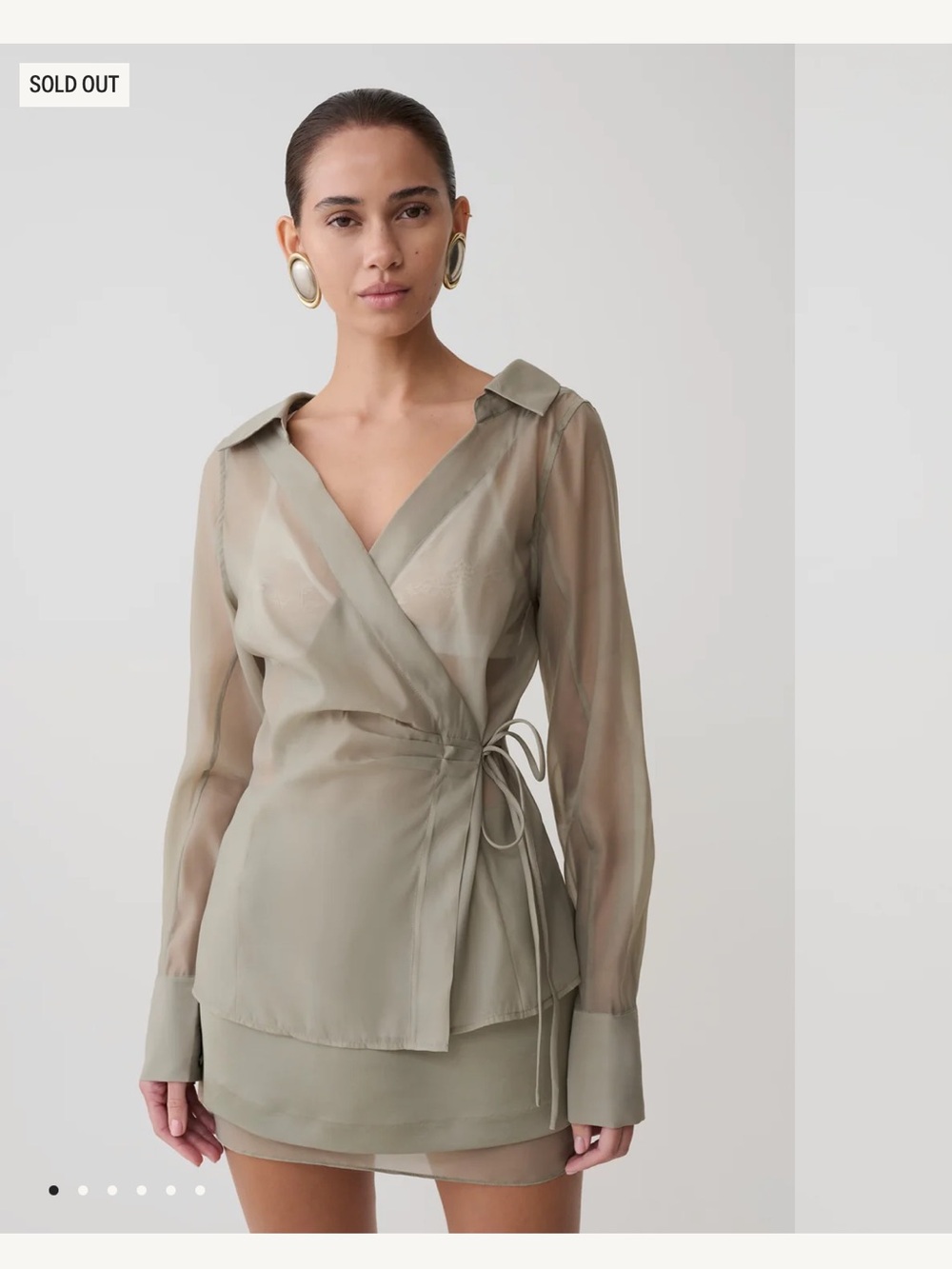 Meshki Frankie NWT
Organza Sheer Wrap Blouse size M- Sold Out online.